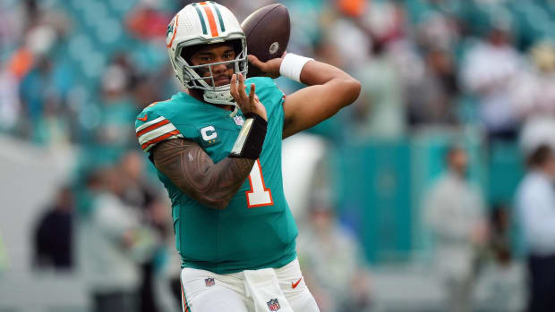 Miami Dolphins quarterback Tua Tagovailoa throws a pass in warmups before a game.